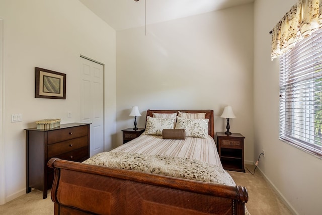 bedroom featuring light carpet