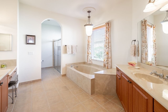 bathroom with vanity, tile patterned floors, and independent shower and bath