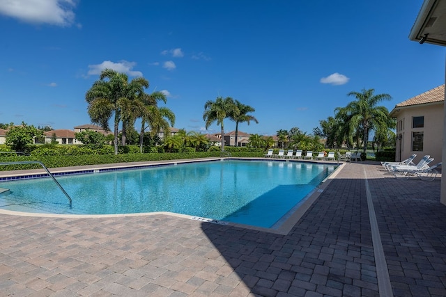 view of swimming pool with a patio area