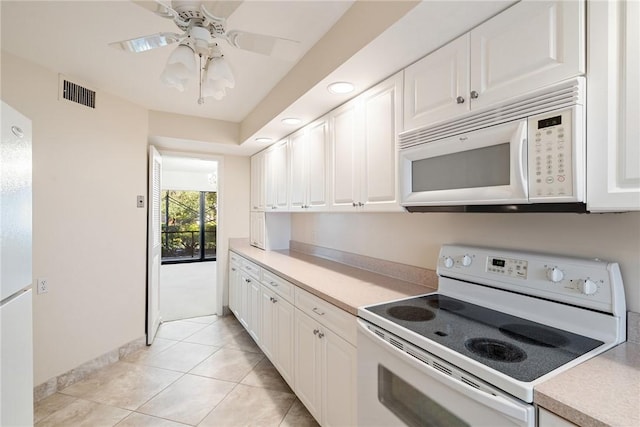 kitchen with white cabinetry, white appliances, ceiling fan, and light tile patterned flooring