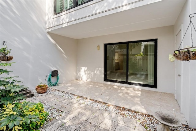 doorway to property with a patio