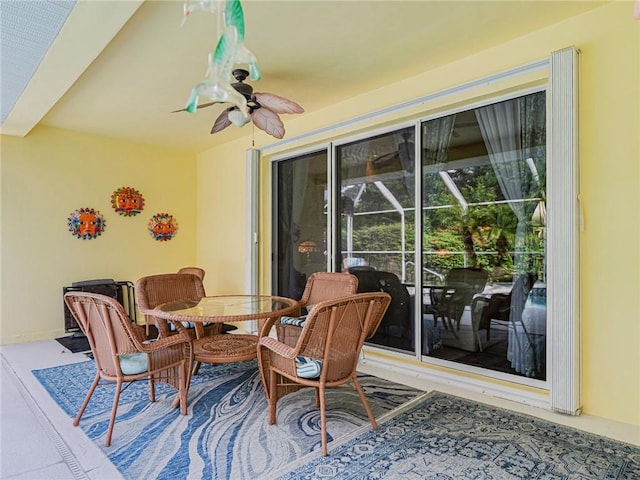 view of patio / terrace featuring outdoor dining space and a ceiling fan