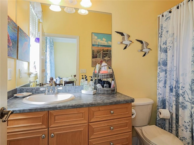 full bathroom featuring toilet and vanity