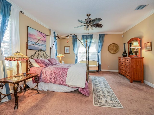 bedroom with baseboards, carpet floors, ornamental molding, and visible vents