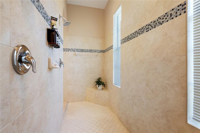 full bath featuring tiled shower