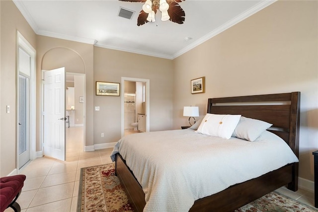 bedroom featuring visible vents, baseboards, ornamental molding, light tile patterned floors, and ensuite bathroom