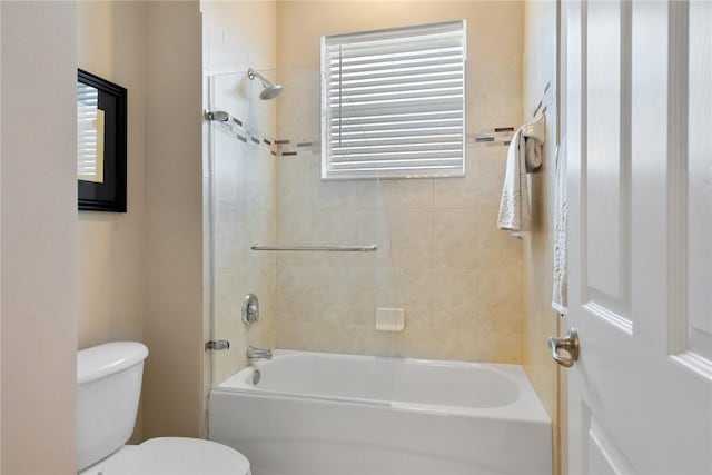 bathroom featuring shower / bathing tub combination and toilet