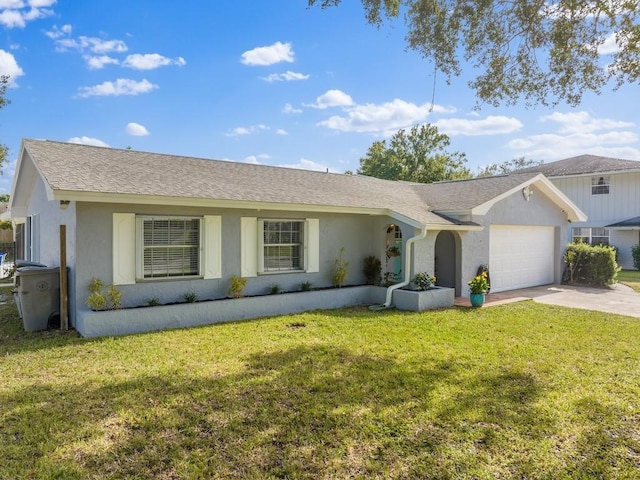 ranch-style house featuring a front yard and a garage