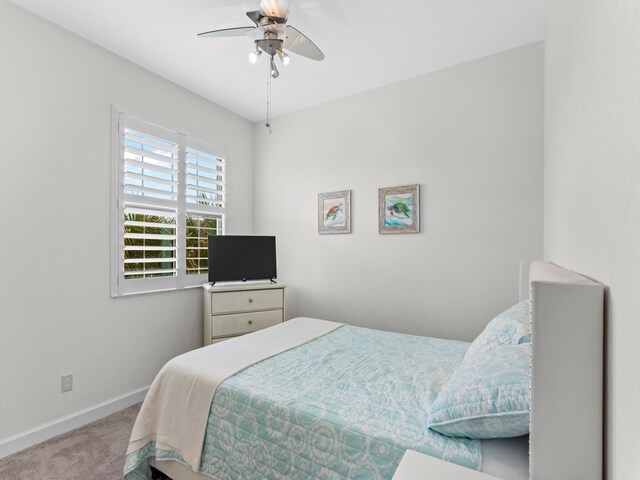 bedroom featuring ceiling fan and carpet floors