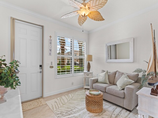 living room featuring light tile patterned floors, ceiling fan, and crown molding