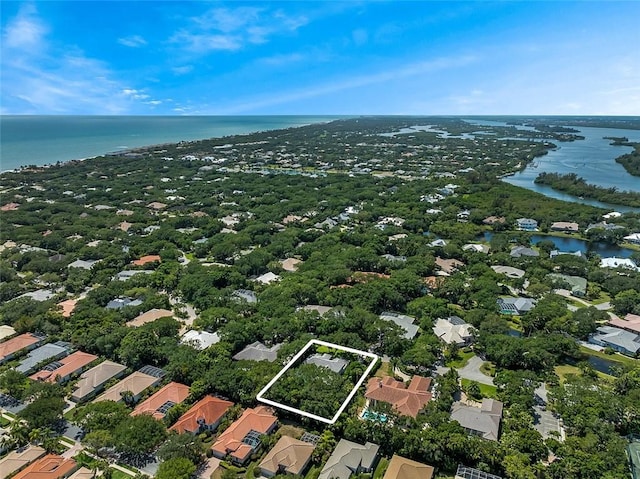 bird's eye view with a residential view and a water view