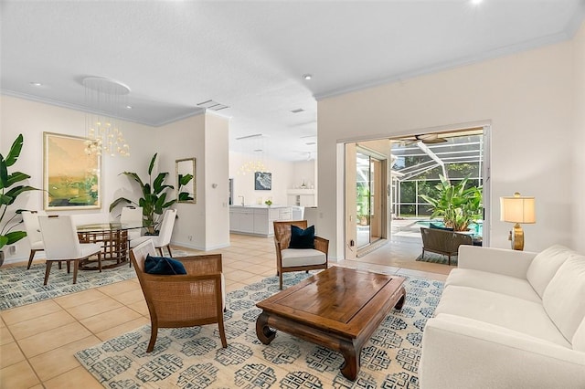living area featuring baseboards, ornamental molding, a sunroom, and light tile patterned floors