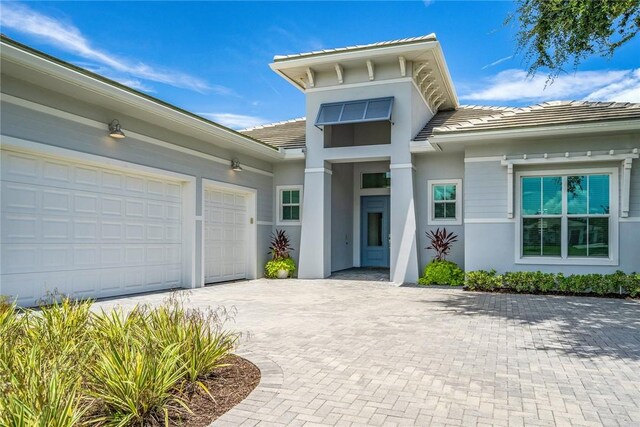 doorway to property featuring a garage