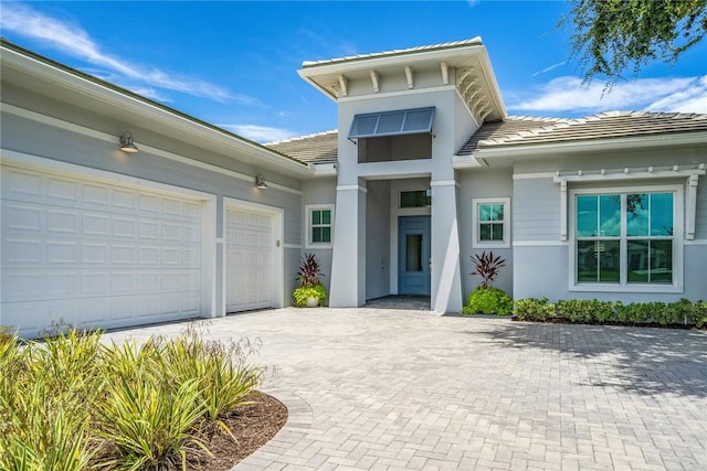 entrance to property featuring a garage