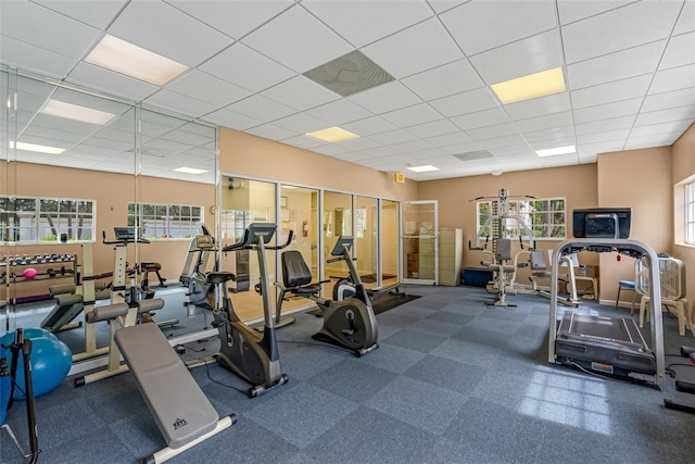 workout area featuring a paneled ceiling