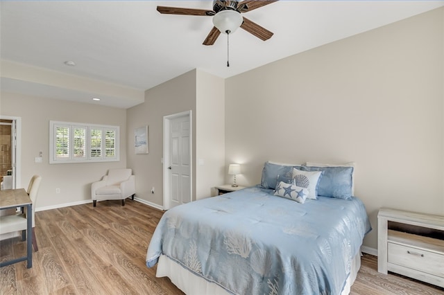 bedroom featuring light wood-type flooring and ceiling fan