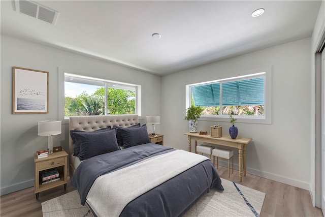 bedroom with light hardwood / wood-style floors