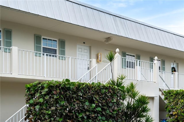 900 Jasmine Ln Unit 203A, Vero Beach, FL 32963 - view of building exterior featuring stairway
