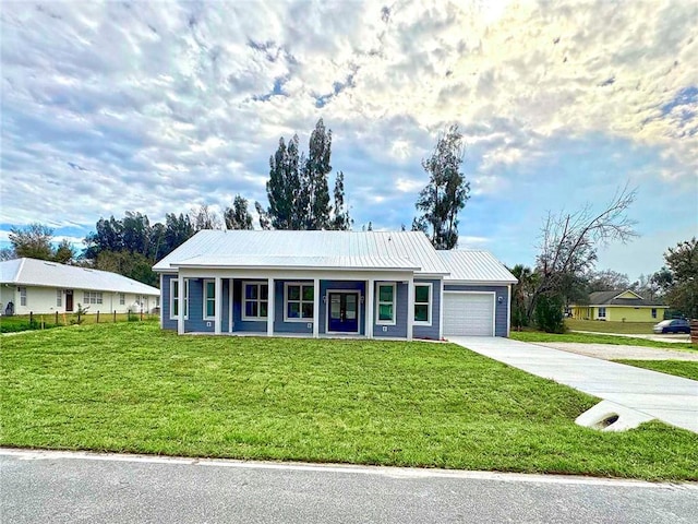 ranch-style house with a porch, a front lawn, and a garage