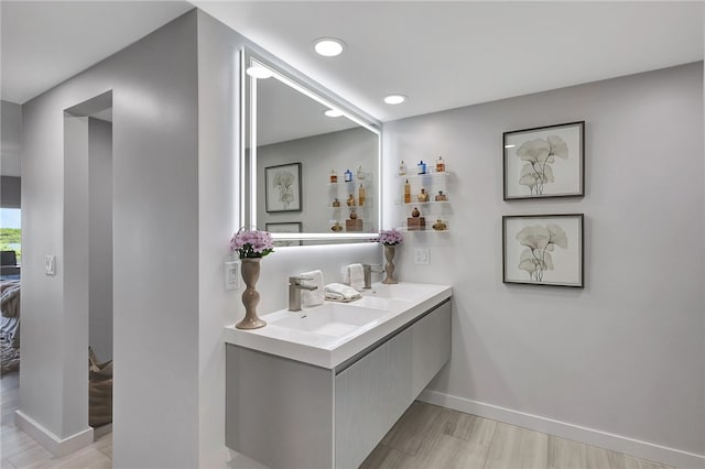 bathroom featuring vanity and wood-type flooring