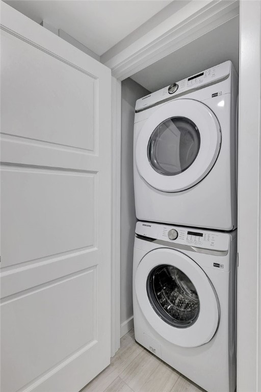 laundry room featuring stacked washer and clothes dryer