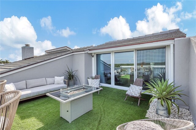 view of patio featuring an outdoor living space with a fire pit