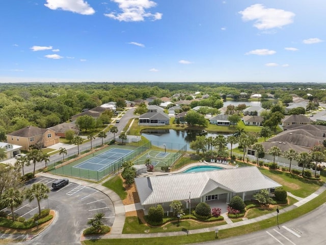 drone / aerial view with a residential view and a water view