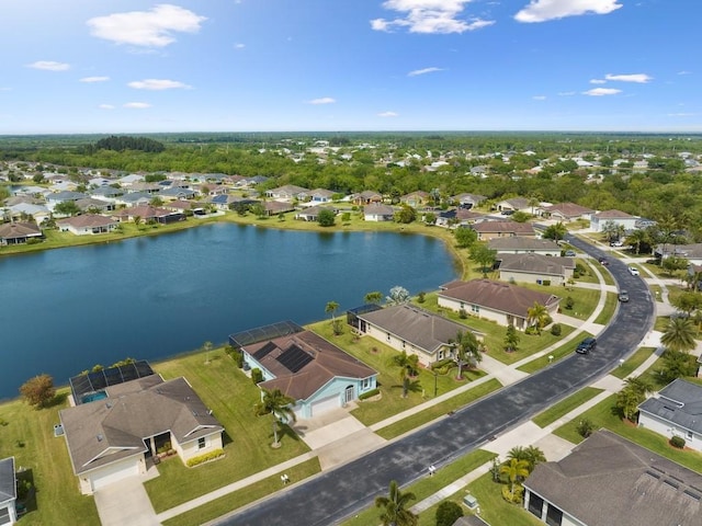 birds eye view of property featuring a water view and a residential view