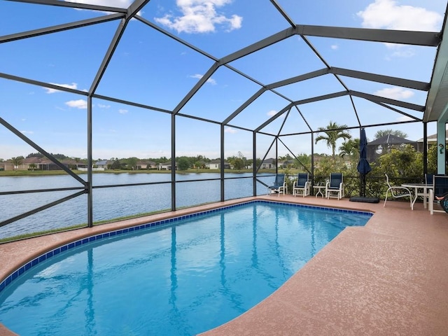 pool featuring a water view, a patio, and a lanai