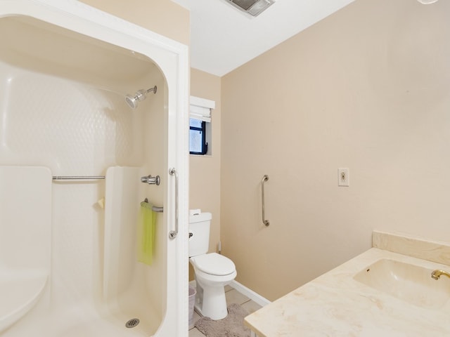 bathroom with walk in shower, tile patterned flooring, vanity, and toilet