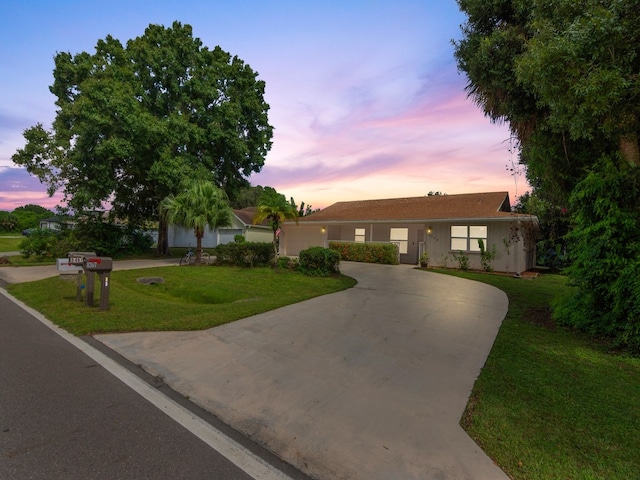 ranch-style house with a lawn