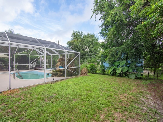 view of yard with a lanai