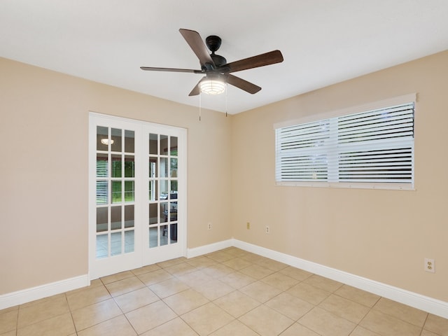 unfurnished room featuring french doors, ceiling fan, and light tile patterned floors