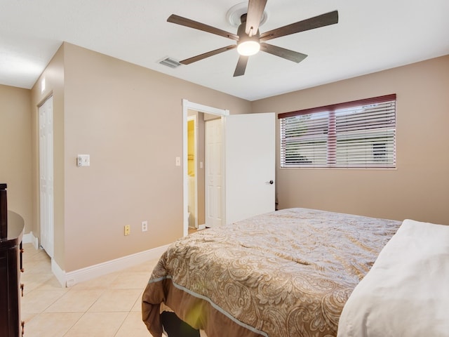 bedroom featuring light tile patterned flooring and ceiling fan