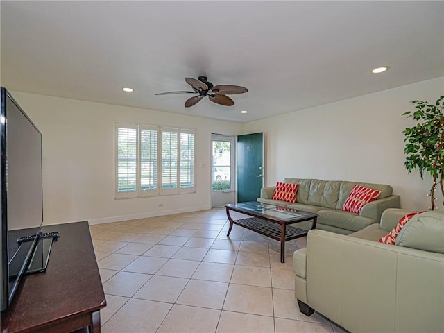 living room with a ceiling fan, recessed lighting, light tile patterned flooring, and baseboards