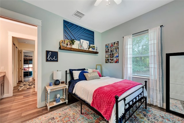 bedroom featuring light wood-type flooring and ceiling fan