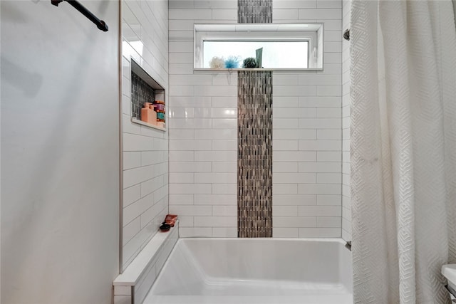 bathroom with shower / bathtub combination with curtain