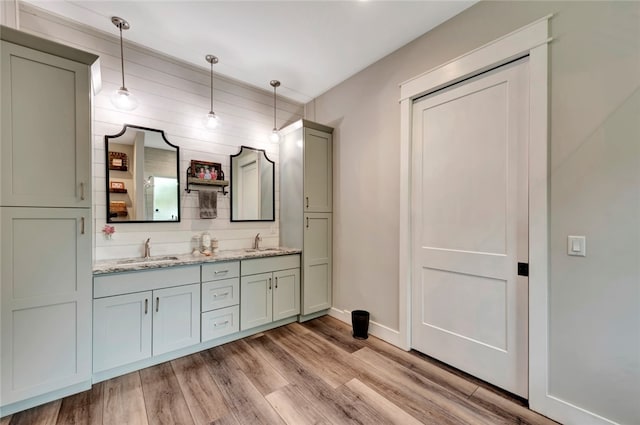 bathroom with wood-type flooring and vanity