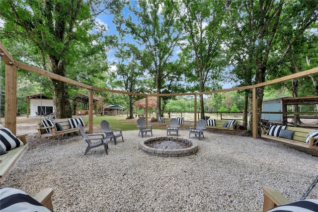 view of patio with a fire pit