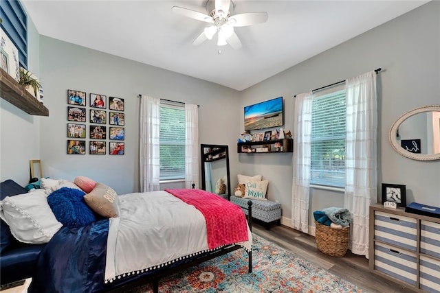 bedroom featuring dark wood-type flooring and ceiling fan