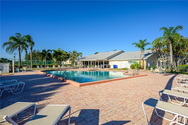 view of swimming pool featuring a patio