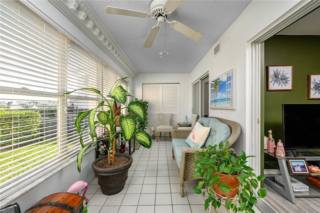 sunroom / solarium with ceiling fan