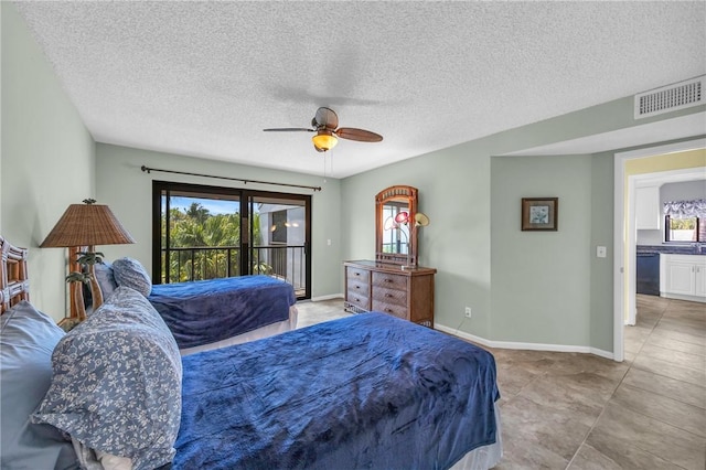 bedroom with a textured ceiling, visible vents, access to outside, and multiple windows