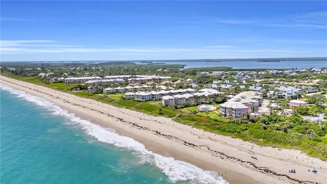 drone / aerial view with a view of the beach and a water view
