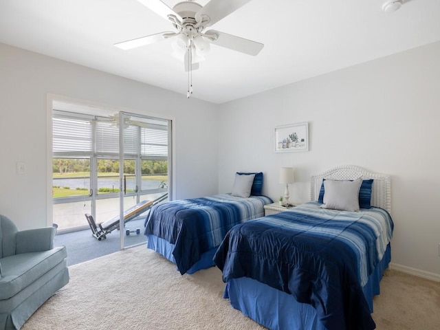 bedroom featuring light carpet, ceiling fan, and baseboards