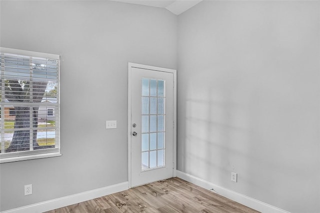 1545 22nd Ave SW, Vero Beach, FL 32962 - doorway featuring wood finished floors and high vaulted ceiling