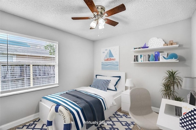 1545 22nd Ave SW, Vero Beach, FL 32962 - bedroom with a textured ceiling and ceiling fan