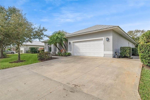 single story home featuring a garage and a front yard
