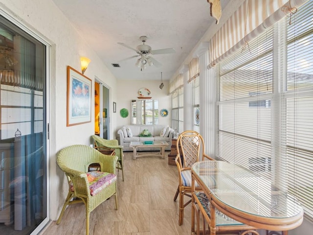 sunroom / solarium with ceiling fan