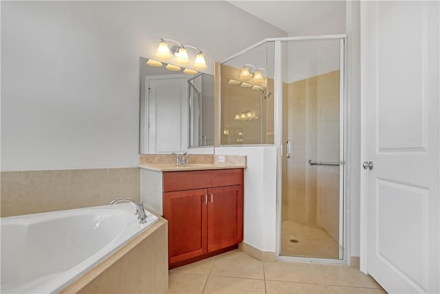 bathroom with plus walk in shower, vanity, and tile patterned flooring